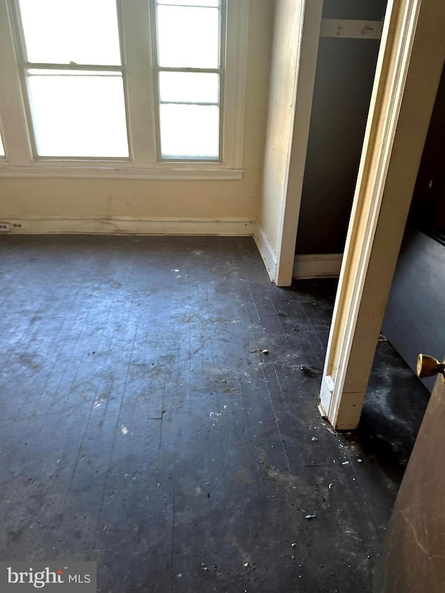 spare room with dark hardwood / wood-style floors