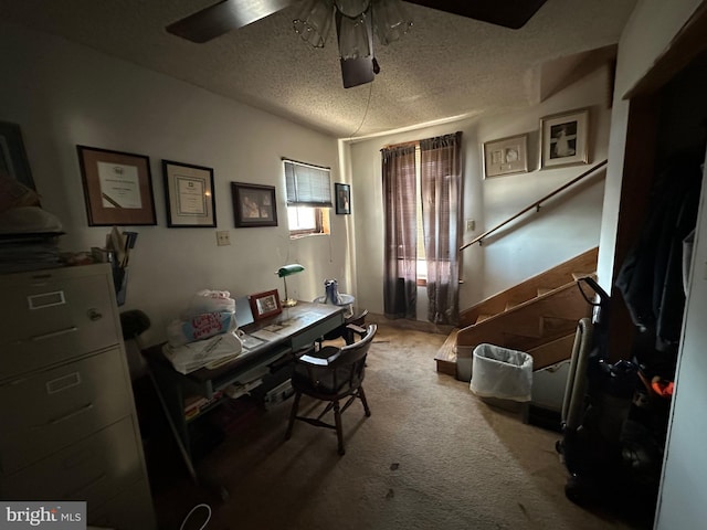 home office featuring ceiling fan, a textured ceiling, and carpet flooring