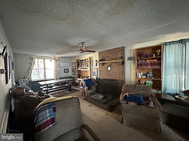 living room featuring ceiling fan, carpet flooring, and a textured ceiling