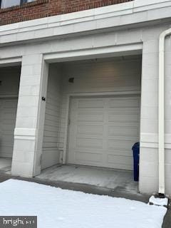 view of snow covered garage