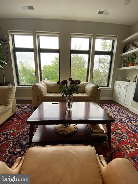 living room featuring visible vents