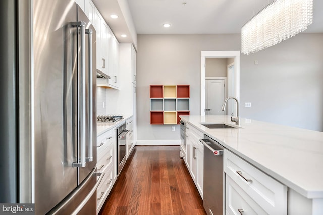 2 Stationmaster St SE Unit 302, Leesburg, VA 20175 - kitchen featuring dark wood-style flooring, recessed lighting, white cabinetry, a sink, and stainless steel appliances