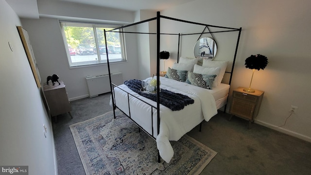 carpeted bedroom featuring radiator heating unit