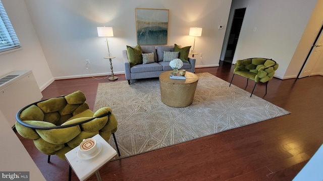 living room featuring dark hardwood / wood-style flooring