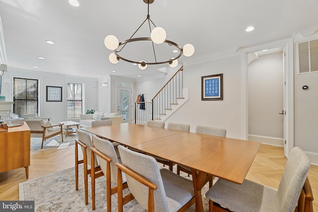 dining space with ornamental molding and light parquet flooring