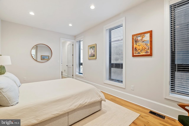 bedroom with hardwood / wood-style flooring