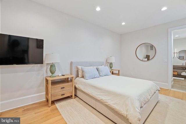 bedroom with light wood-type flooring