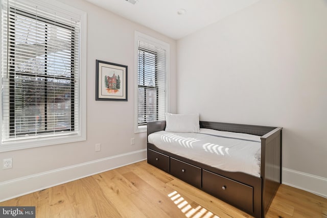 bedroom with light wood-type flooring