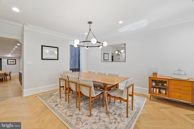 dining space featuring ornamental molding, a chandelier, and light parquet floors