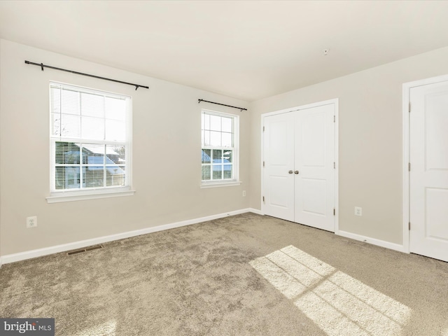 unfurnished bedroom featuring carpet floors