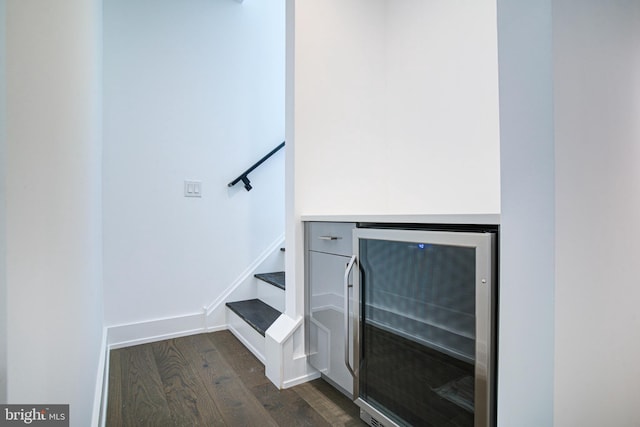 interior details with wine cooler and hardwood / wood-style floors