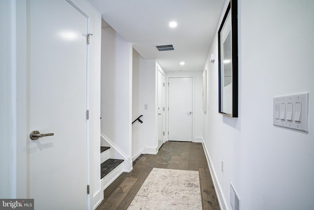 hall with dark hardwood / wood-style floors