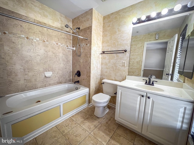 full bathroom featuring vanity, toilet, and tiled shower / bath combo