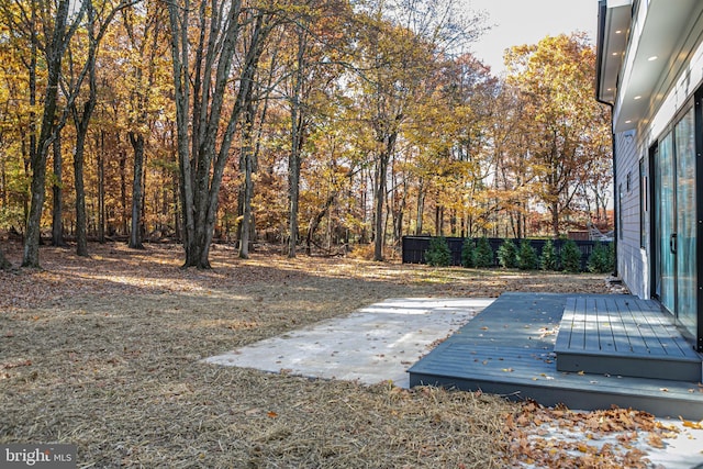 view of yard with a wooden deck