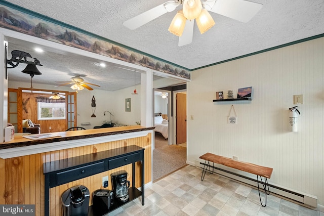 kitchen featuring a baseboard radiator and a textured ceiling