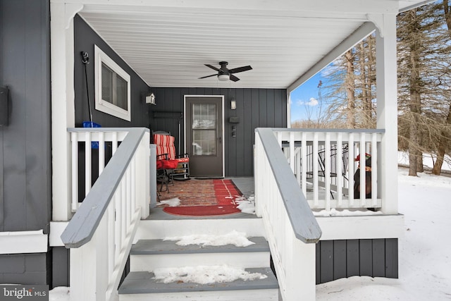 snow covered property entrance featuring ceiling fan