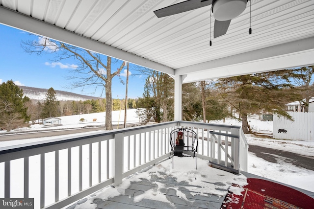 snow covered deck with ceiling fan