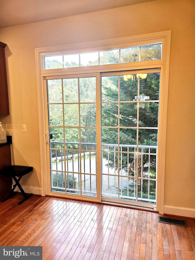 doorway to outside featuring hardwood / wood-style flooring