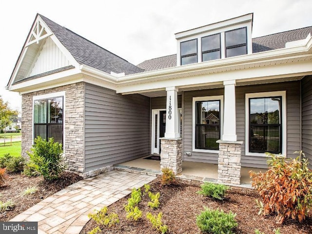 doorway to property with a porch