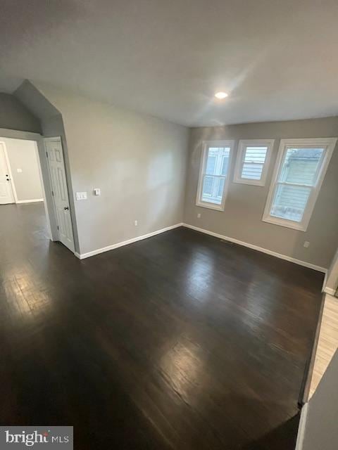 empty room featuring dark hardwood / wood-style floors