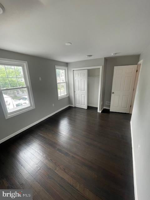 interior space with dark wood-type flooring