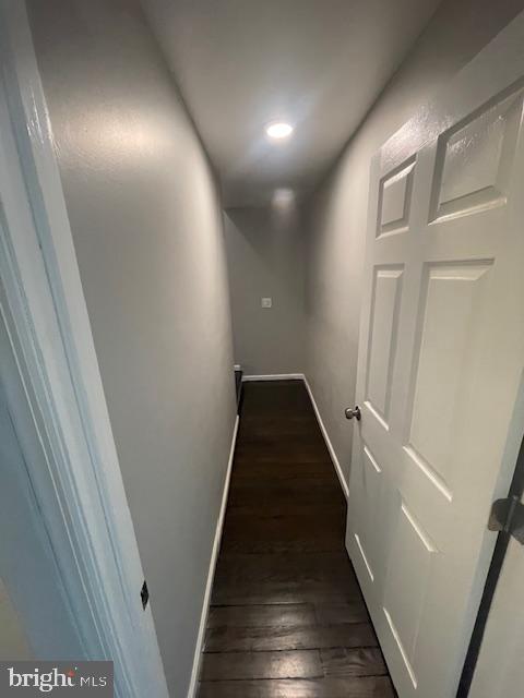 hallway featuring dark hardwood / wood-style flooring