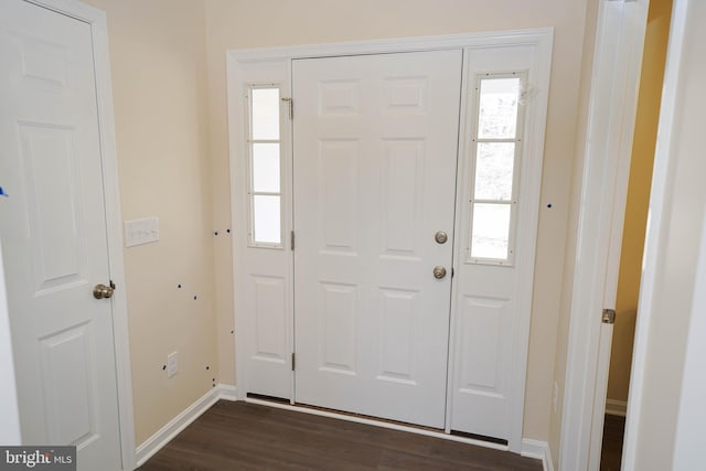 entryway featuring a healthy amount of sunlight and dark wood-type flooring