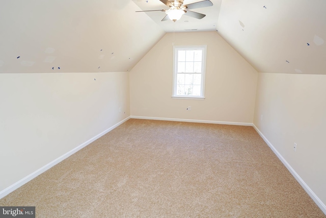 bonus room featuring light carpet, vaulted ceiling, and ceiling fan