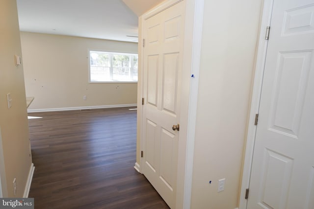 hallway with dark hardwood / wood-style floors