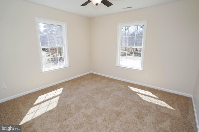 empty room with light carpet and ceiling fan