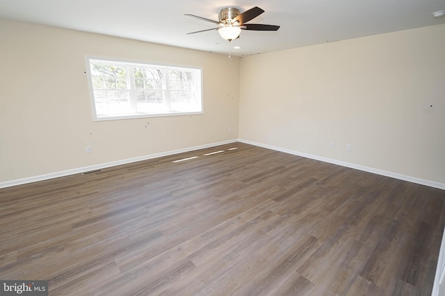 empty room featuring ceiling fan and hardwood / wood-style flooring