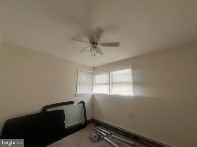 workout room featuring ceiling fan