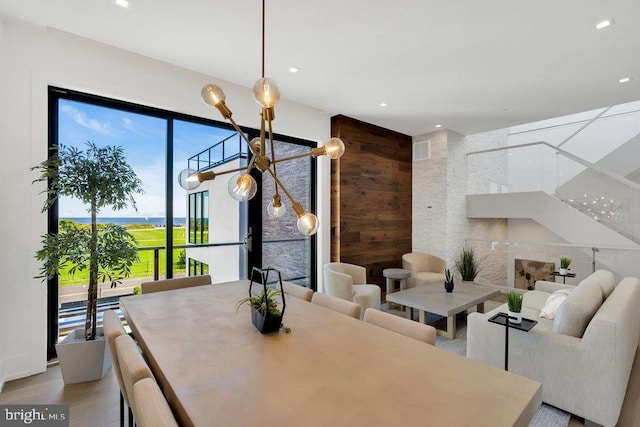 dining area featuring hardwood / wood-style floors and wooden walls