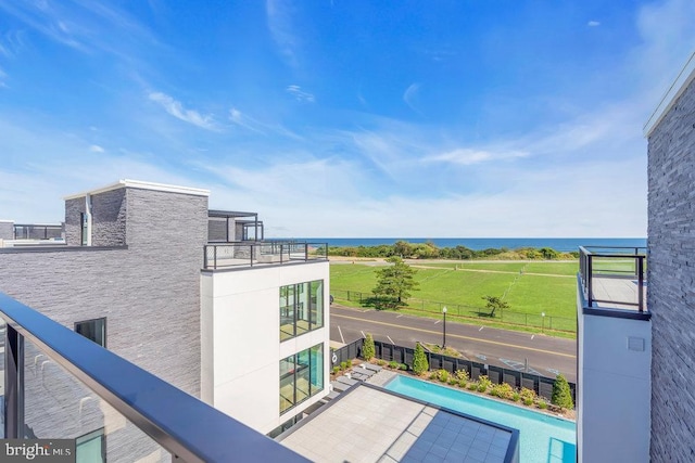 balcony featuring a water view