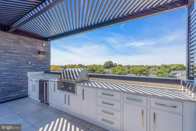 view of patio / terrace with area for grilling and exterior kitchen