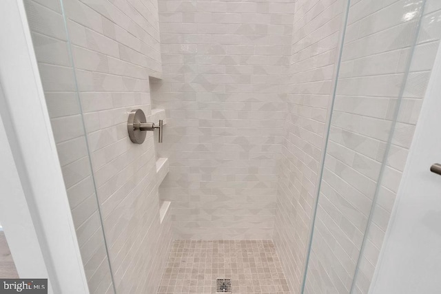 details with a tile shower