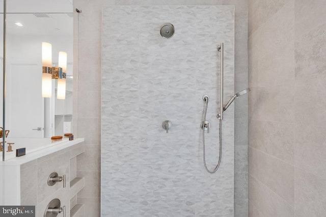 bathroom with tiled shower