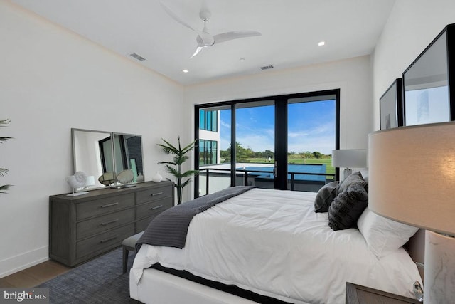 bedroom featuring access to exterior, hardwood / wood-style floors, and ceiling fan