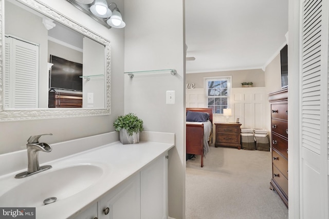 bathroom with vanity and crown molding