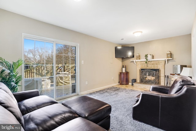 living room with carpet flooring and a fireplace