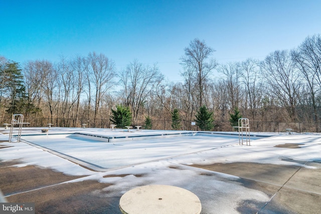 snow covered pool with basketball hoop