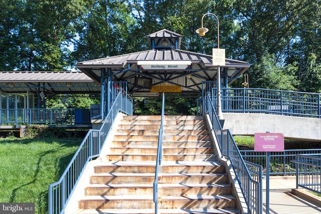 exterior space with a gazebo and a lawn