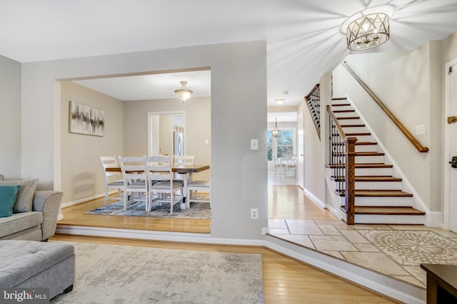 living room featuring hardwood / wood-style floors and a chandelier