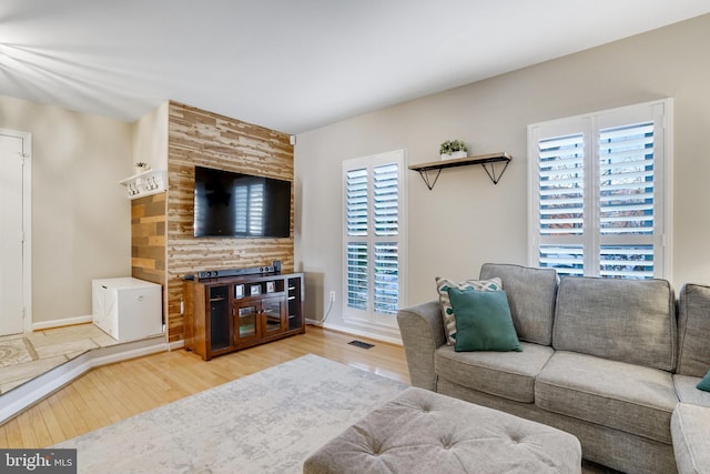 living room featuring hardwood / wood-style floors and a wealth of natural light