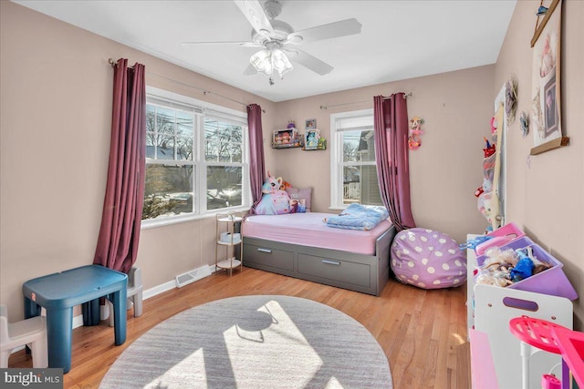 bedroom featuring light hardwood / wood-style flooring and ceiling fan