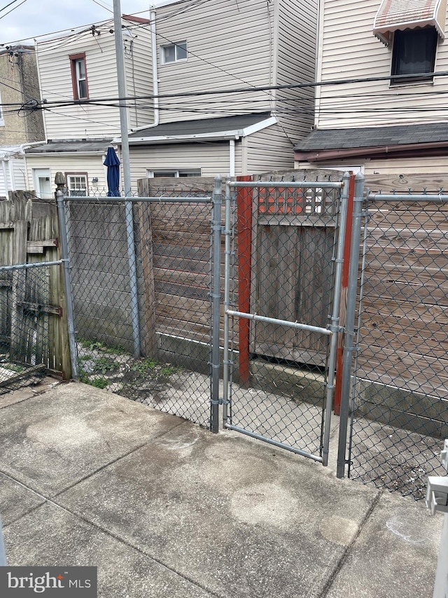 view of gate with fence