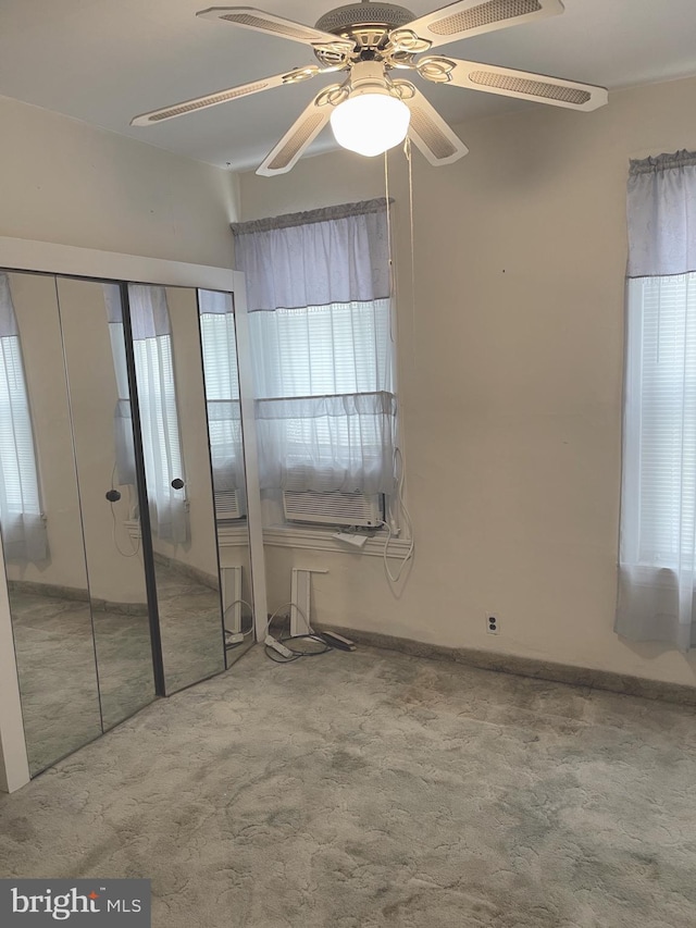 unfurnished bedroom with carpet and ceiling fan