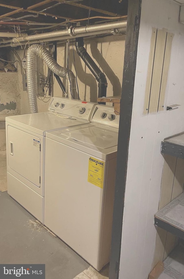 clothes washing area featuring laundry area and separate washer and dryer