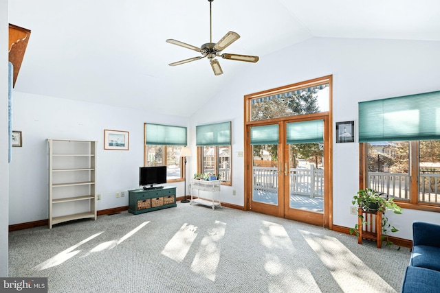 unfurnished living room with ceiling fan, carpet flooring, french doors, and high vaulted ceiling