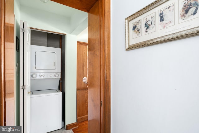 laundry area featuring stacked washer and clothes dryer